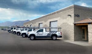 Southern Arizona Roof Associates roofing vehicles in front of their building in Tucson Arizona. 